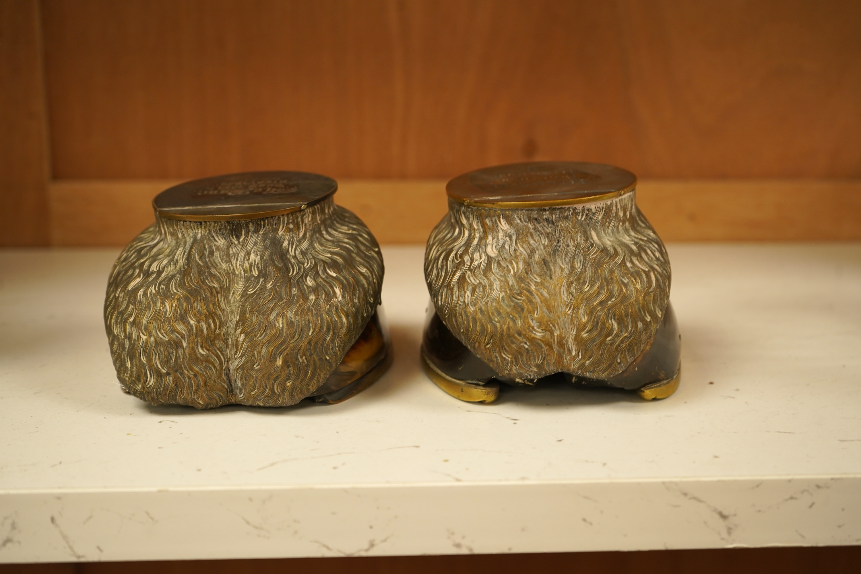 Two Victorian taxidermic horse hoof inkwells with inscriptions to the lids, 13cm wide